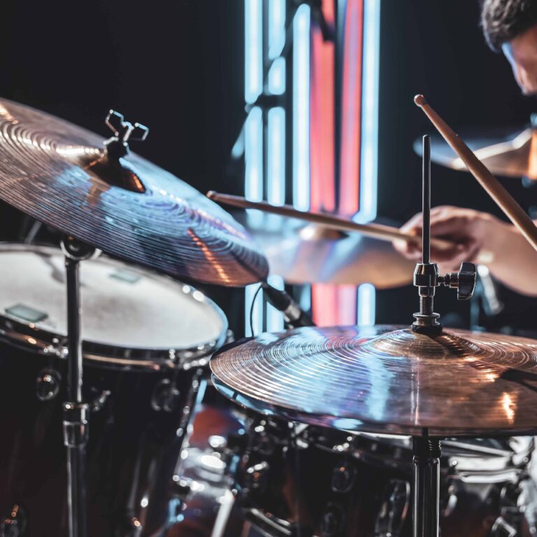 close-up-drum-cymbals-as-drummer-plays-with-beautiful-lighting-blurred-background