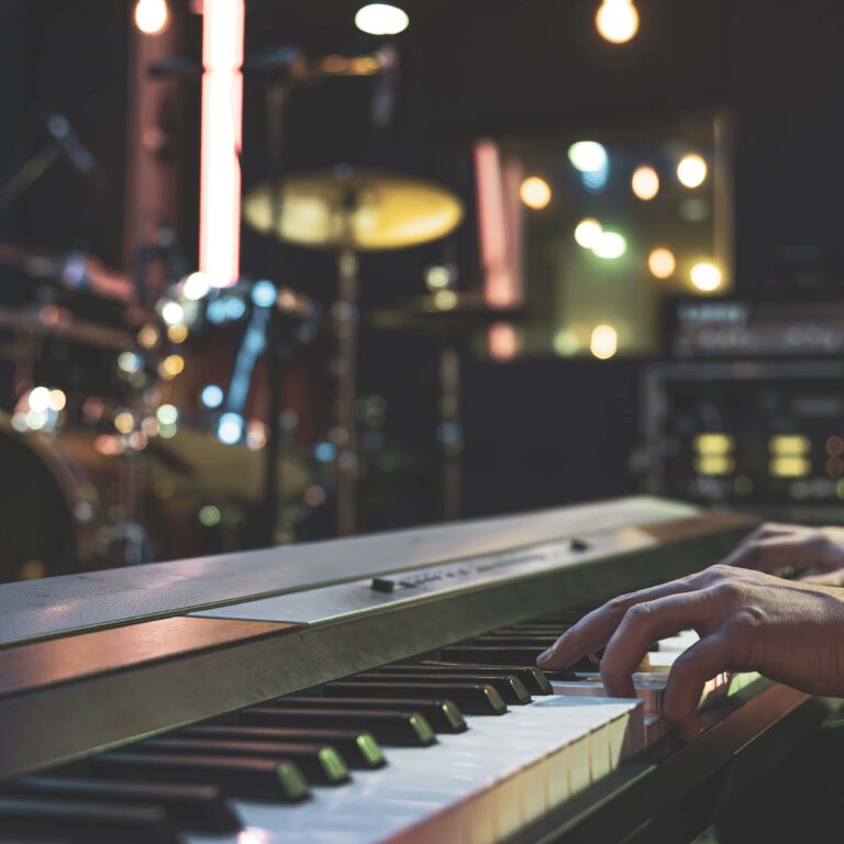 Hands of a musician playing the keys close up